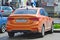 Wet Hyundai Solaris 1.6 Orange in Russia.