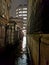 The wet passageway beside Grey Friars Church, London & x28;Wren Church& x29; at evening time