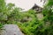 Wet path on slope before 1930s` mansion in light summer rain