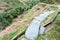 wet pathway and irrigation ditch on slope of hill