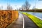 Wet pedestrian and bicycle path on a clear winter day