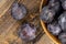 Wet purple plum on the table, fresh harvest