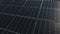 Wet PV panels on a house roof during sunrise - Aerial tracking shot