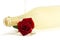 Wet red rose with a empty champagne glass in front