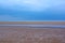Wet sandy beach, blue sky and the sea, Northern Sea, Holkham beach, United Kingdom