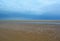 Wet sandy beach and deep blue sky, Northern Sea, Holkham beach, United Kingdom