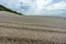 Wet sea sand, deserted sea beach, seashore after rain