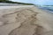 Wet sea sand, deserted sea beach, seashore after rain