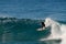 A wet-suited man completes a top-turn, on a nice wave - riding frontside at Iluka`s North Wall.