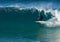 A wet-suited man prepares to enter a barrelling wave - frontside at Iluka`s North Wall.