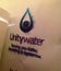 Wet UNITY WATER logo blurred