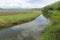 wetland river landscape with clouds in water