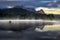 Wetterstein mountain during autumn day with morning fog over Geroldsee lake, Bavarian Alps, Bavaria, Germany.