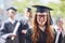 Weve made it. Portrait of a happy female student standing outside on her graduation day.