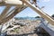 Whakatane heads beach and waterfront with logs and driftwood washed up across beach and outlook to horizon and Whale Island