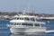 Whale Watcher cruise boat leaving Fairhaven with New Bedford in background