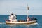 Whale watching boat with passengers going out the Husavik for waching the Humpback Whale.