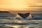 A whale waves its tail in the water at sunset, Generative AI