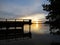 Wharf Catwalk During Sunset Over Beautiful Lake with Cloudy Sky in background