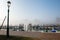 Wharf in quit bay, foggy weather, italian island Burano, province of Venice, Italy. Little beautiful dock with boats,