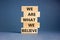 We are what we believe symbol. Concept words We are what we believe on wooden blocks. Beautiful grey table grey background.