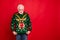 What did i get. Portrait of amazed shocked old man look at reindeer pattern sweater for christmas theme party received