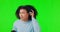 What, disturb and black woman with headphones on green screen to hear talking, speaking and speech. Communication, deaf