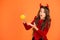What do you fantasy for Halloween. Surprised girl hold small pumpkin orange background. Creative fantasy. Fantasy and