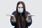 What do you want? Portrait of anger brunette asian young woman with surgical medical mask in casual blue denim jacket standing