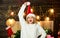 What a great surprise. oh my god. xmas mood. winter holidays celebration. girl in red santa claus hat. Cheerful woman