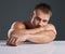 What a hunk. Studio portrait of a handsome and hunky young man posing in studio against a gray background.