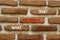 What inspires you symbol. Concept words What inspires you on beautiful brown brick. Beautiful red brown brickwall background.