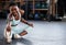 We are what we repeatedly do.a fit young woman stretching at the gym.