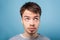 What`s with my hair. Closeup portrait of young brunette man looking up with inquiring gaze, dissatisfied with messy fringe