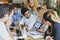 What a stellar team. Shot of a group of business people having a meeting in a cafe.