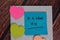 It is What It Is text on sticky notes with office desk