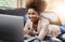 What weekends were made for. an attractive young woman using laptop while chilling at home on the sofa.