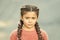 What is wrong. Hairdresser salon. Braided cutie. Little girl with cute braids close up. Kanekalon strand in braids of