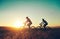 Whatever you do, keep moving forward. a pair of adventurous mountain bikers out on a trail on a sunny day.