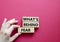 Whats behind fear symbol. Concept words Whats behind fear on wooden blocks. Beautiful red background. Businessman hand. Busine