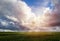 Wheat agriculture field with cloudy sky and sun. Czech summer landscape