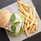 Wheat beef sandwich hamburger, fried potatoes, ketchup served for launch