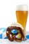 Wheat beer with bavarian towel and pretzel