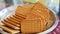 Wheat biscuits in the steel plate with blur background. Indian biscuits popularly known as Chai-biscuit in India