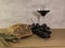 A wheat bread and red grapes with wine