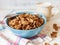 Wheat buckwheat bran breakfast cereal with milk in ceramic bowl