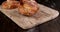 wheat bun with coconut filling falls on a wooden table