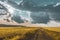 wheat field under sunset cloud sky