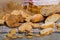 Wheat and grain baguettes, croissants and biscuits on wicker mat