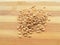 Wheat grain heap on wooden background
